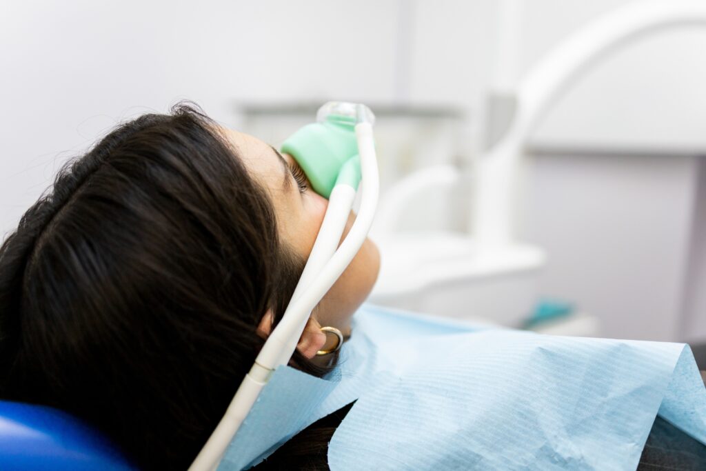 A female patient receiving sedation dentistry in denver for dental anxiety